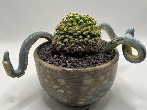 Octopot - Ocean-inspired ceramic vessel with octopus design